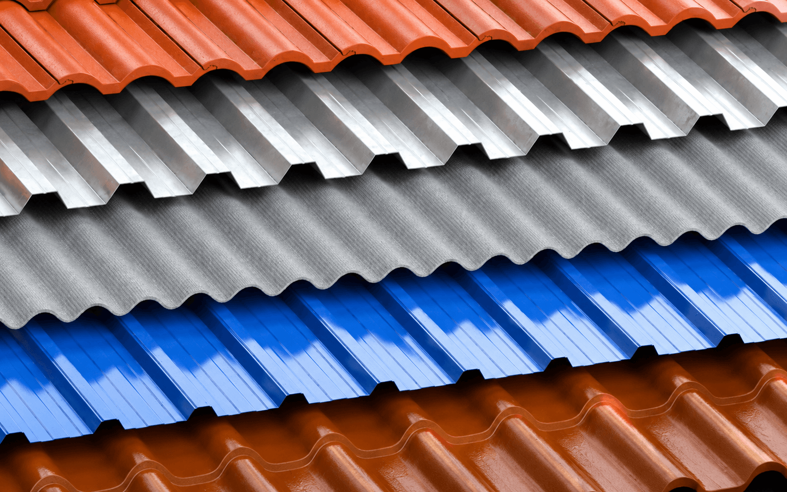 Stacked corrugated metal roofing panels in red, silver, grey, blue, and brown