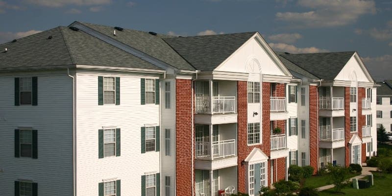 Multi-building apartment complex with brick and siding exterior