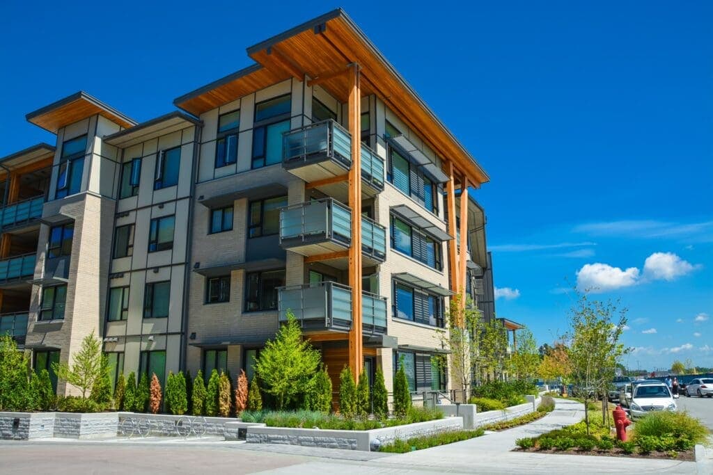 Modern condo development with wood-accented balconies