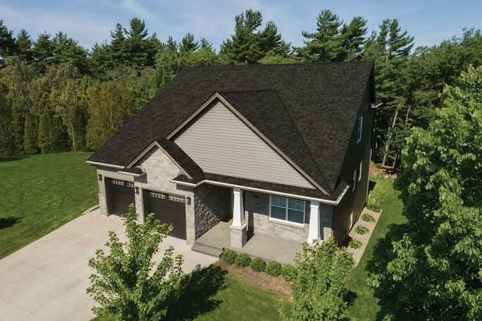 Single-family rental home with dark shingle roof and driveway